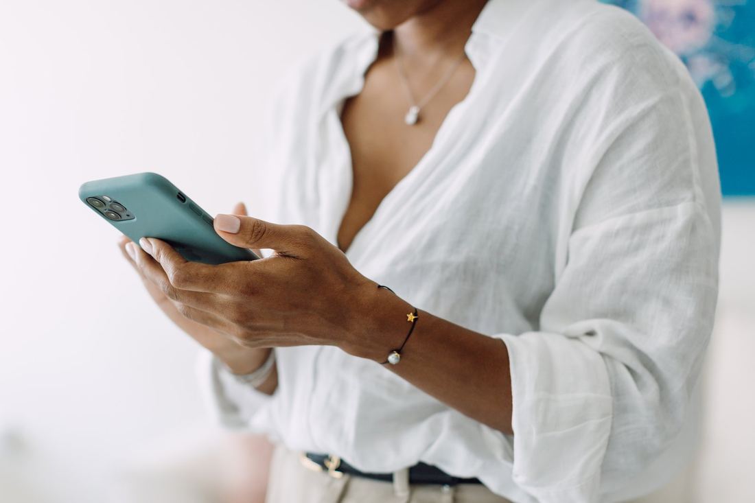 A participant checking in on her phone